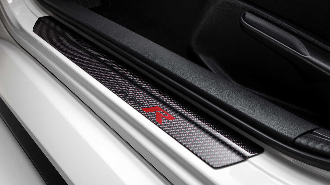 Close up of Honda Civic Type R Carbon Fibre door sill trims.