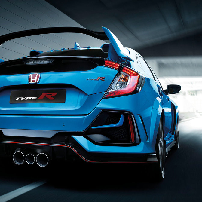 Rear three-quarter facing Honda Civic Type R outside.