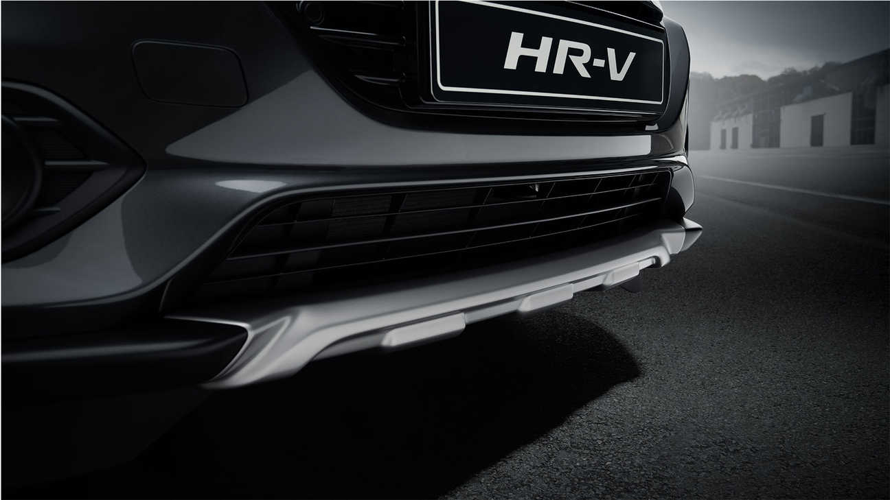 Honda HR-V, Nahaufnahme Stoßfängerverkleidung vorn in Titanlackierung.