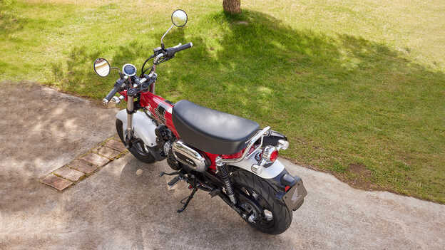 Honda Dax 125 with a low seating position and wide handlebars that are swept up
