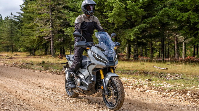 Honda X-ADV, 3/4 front right view, with rider, forest track