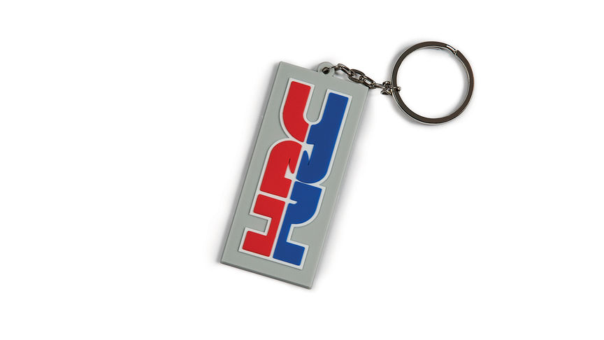 Grauer Honda Schlüsselanhänger in HRC-Farben mit Honda Racing Corporation Logo.