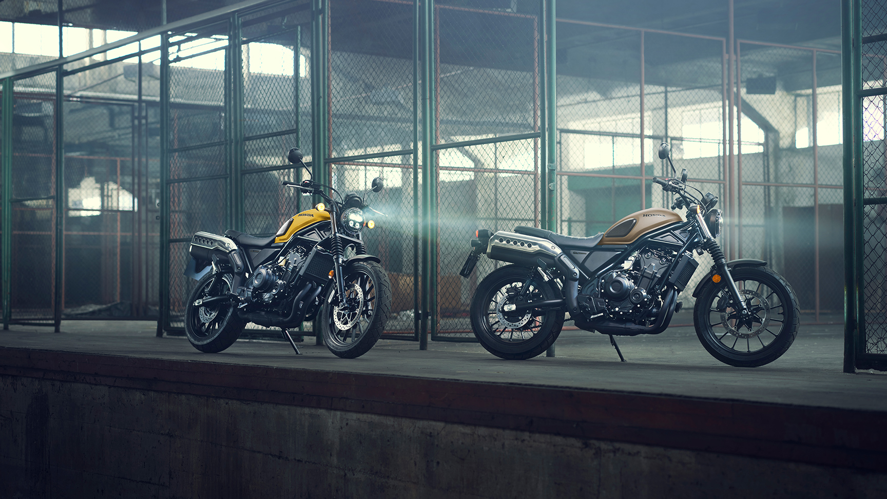 Honda CL500 motorcycles in a warehouse location.