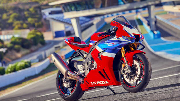 Honda CBR1000RR-R Fireblade, 3/4 front view, parked on the racetrack.